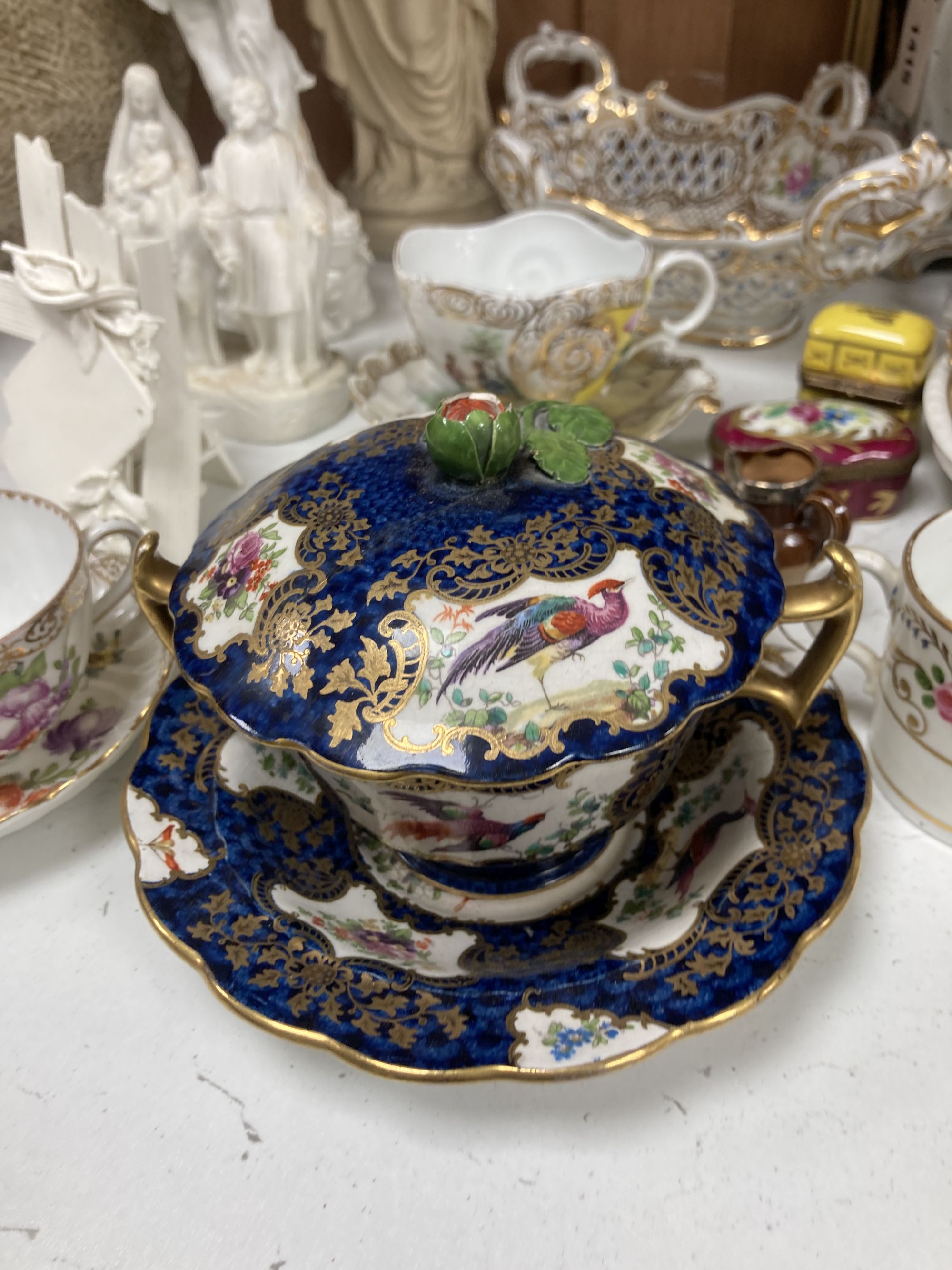 A collection of figurines, cabinet cups plates, two boxes, etc.